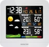 A digital weather station displaying time, date, outdoor and indoor temperature and humidity, and a weather forecast graphic. Náhled obrázku produktu