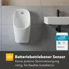 A urinal and a sink mounted on a tiled wall. Produktbild-Vorschau