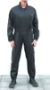 A person wearing a black jumpsuit standing against a white background. Náhled obrázku produktu