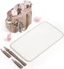 A baby bag and accessories are displayed on a white background. Produktbild-Vorschau