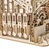 Close-up view of a wooden marble run construction kit, showing intricate gears and wooden pieces. Náhľad obrázku produktu