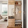 A compact wardrobe with a mirror and bench in a hallway, showcasing storage and seating. Voir les images du produit