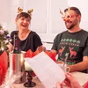 A group of people celebrating Christmas at a dinner table. Produktbild-Vorschau