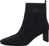 A single black ankle boot with a patterned design and a block heel, isolated on a white background. Produktbild-Vorschau