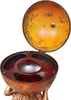 A globe bar with the lid open, revealing the interior storage compartments. The globe is supported by a figure resembling Atlas. Náhľad obrázku produktu