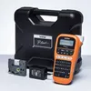 A Brother P-touch label maker kit with its case, accessories, and power adapter. Produktbild-Vorschau