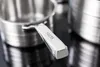 A close-up shot of a stainless steel pot handle with the brand name 'SALLY'S' engraved on it. Produktbild-Vorschau