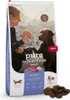 A bag of dog food with a woman and a dog in the background. Produktbild-Vorschau