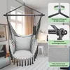 A hanging chair in a room with a window and desk in the background, with close-up diagrams of its features. Produktbild-Vorschau