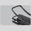 A close-up, angled view of a black phone case, showing its layered design and textured surface. Produktbild-Vorschau