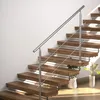 A modern staircase with wooden steps and a stainless steel railing. Produktbild-Vorschau