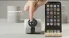 A hand is shown interacting with a smartwatch next to a smartphone, demonstrating Bluetooth connectivity. Produktbild-Vorschau