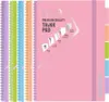 A collection of spiral-bound notebooks with colorful covers and dividers, displayed against a white background with marketing text and graphics on the front cover of one notebook. Voir les images du produit