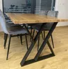 A dining table with chairs in a room. Anteprima dell’immagine prodotto