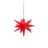 A red star-shaped ornament hangs from a thin wire against a white background. Produktbild-Vorschau