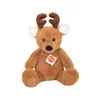 A brown teddy bear with antlers and white inner ears sits facing forward against a white background. It has a black nose and eyes, and a small red heart-shaped tag with the brand name 'Hermann' printed in white text is attached to its chest. Náhled obrázku produktu