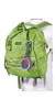 A green backpack with a small, colorful Bluetooth speaker attached to it. Produktbild-Vorschau