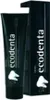 A black tube of Ecodenta toothpaste and its matching black box packaging are shown against a white background. Anteprima dell’immagine prodotto