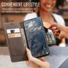 A person is using a phone case with card slots to pay for something at a terminal. Produktbild-Vorschau