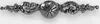 A metallic decorative element with a central circular motif and ornate scrollwork on either side, presented on a white background. Produktbild-Vorschau