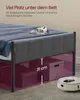 A bed frame with storage boxes underneath, and a robot vacuum cleaner nearby. Produktbild-Vorschau
