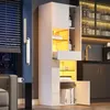 A modern living room or kitchen setting with a tall, white, high-gloss cabinet illuminated by warm LED lights. Anteprima dell’immagine prodotto