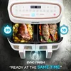 A dual-chamber air fryer with food in both chambers, showcasing its features. Produktbild-Vorschau