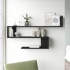 A black wall shelf with decorative items and books. Náhled obrázku produktu