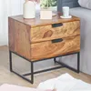 A wooden nightstand with two drawers and black metal legs, placed next to a bed. Podgląd zdjęcia produktu