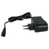 A black power adapter with a cord and plug. Produktbild-Vorschau