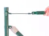A hand holding a green wire tensioner attached to a green fence post with a wire. Produktbild-Vorschau