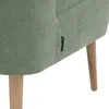 A close-up view of the side of a green armchair, showing a brand tag and wooden legs. Produktbild-Vorschau