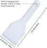 A white plastic ice scraper with dimensions indicated. Produktbild-Vorschau