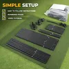 Parts of a golf hitting net laid out on a green surface for assembly. Produktbild-Vorschau