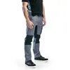 A person wearing work pants and a t-shirt, standing against a white background. Produktbild-Vorschau