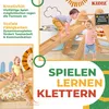 Children playing on a wooden climbing structure with a cat and a pillow. Produktbild-Vorschau
