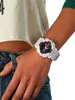 A close-up shot of a person's arm wearing a white Casio G-Shock watch. Produktbild-Vorschau