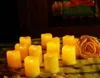 A collection of LED candles and a yellow rose arranged on a checkered cloth. Náhled obrázku produktu