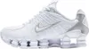A studio shot of a white Nike Shox TL sneaker with silver accents. Voir les images du produit