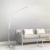 A modern living room scene with a floor lamp and a sofa. Podgląd zdjęcia produktu