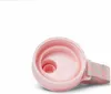 Close-up view of the inside of a pink water bottle lid. Voir les images du produit