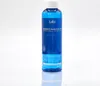 A product shot of a blue bottle of hair treatment against a white background. Produktbild-Vorschau