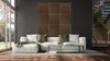 A modern living room with a sectional sofa, coffee table, and decorative wall panels. Anteprima dell’immagine prodotto