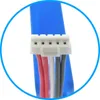 A close-up view of a white connector with multiple colored wires (red, white, gray) emerging from it, attached to a blue cable. Produktbild-Vorschau