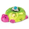 A ceramic turtle ring holder with a blue ring inside. Produktbild-Vorschau