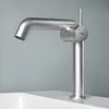 A modern, brushed metal faucet is shown against a plain gray background, positioned over the edge of a white sink. Podgląd zdjęcia produktu