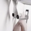 Close-up of a metal hook with black rubber stoppers. Anteprima dell’immagine prodotto