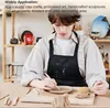 A person is working with clay on a table, with shelves of art supplies in the background. Produktbild-Vorschau