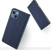 A dark blue flip case for an iPhone 13 is shown from a diagonal angle, with the case open to reveal the camera cutout. Another identical case is shown in the background, also open. Produktbild-Vorschau