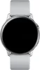 A close-up, front-facing view of a silver Samsung Galaxy Watch Active with a black screen and a white band, set against a plain white background. Produktbild-Vorschau